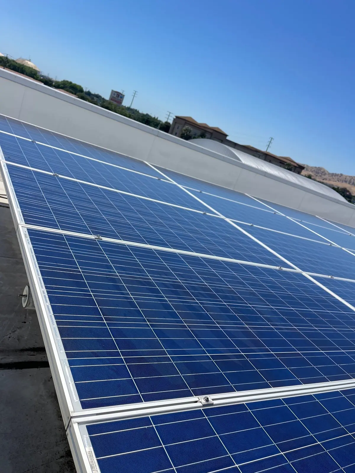 Junior high school district solar carport panels after cleaning, Pittsburg CA